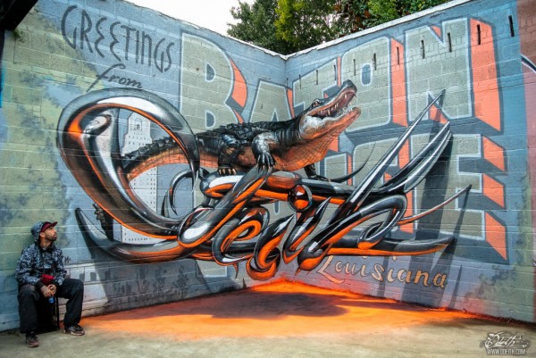 Odeith-aligator-stading-on-Anamorphic-3d-chrome-letters-Greetings-from-Baton-Rouge